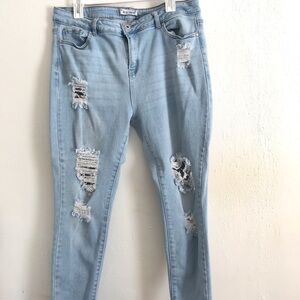 Size 20 light wash distressed denim skinny jeans.